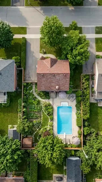 The camera zooms out from the house to the neighborhood and then to Earth from space