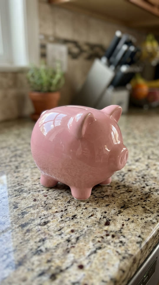 Example photo: a pink ceramic piggy bank on a kitchen counter