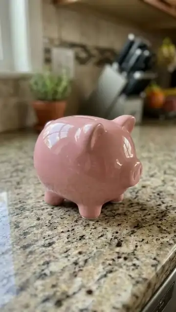 The piggy bank melts like wax into a glossy pink puddle